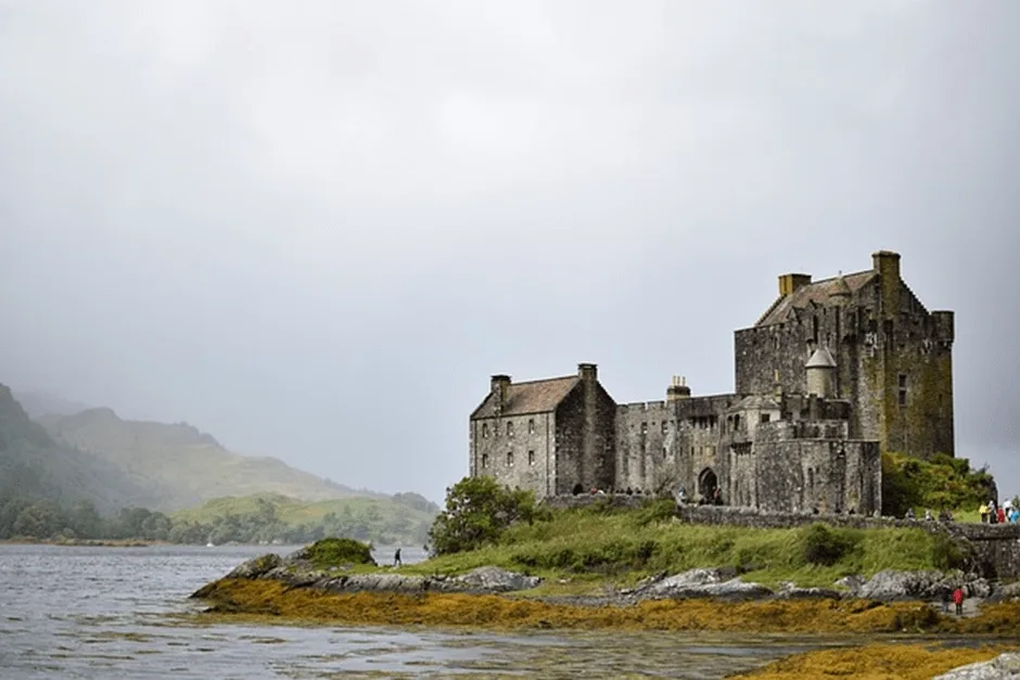 Old castle next to loch in Scotland