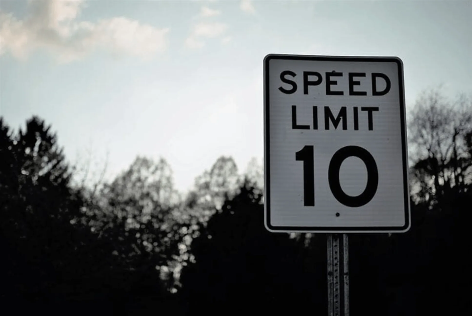 Road sign with speed limit 10 on a white background