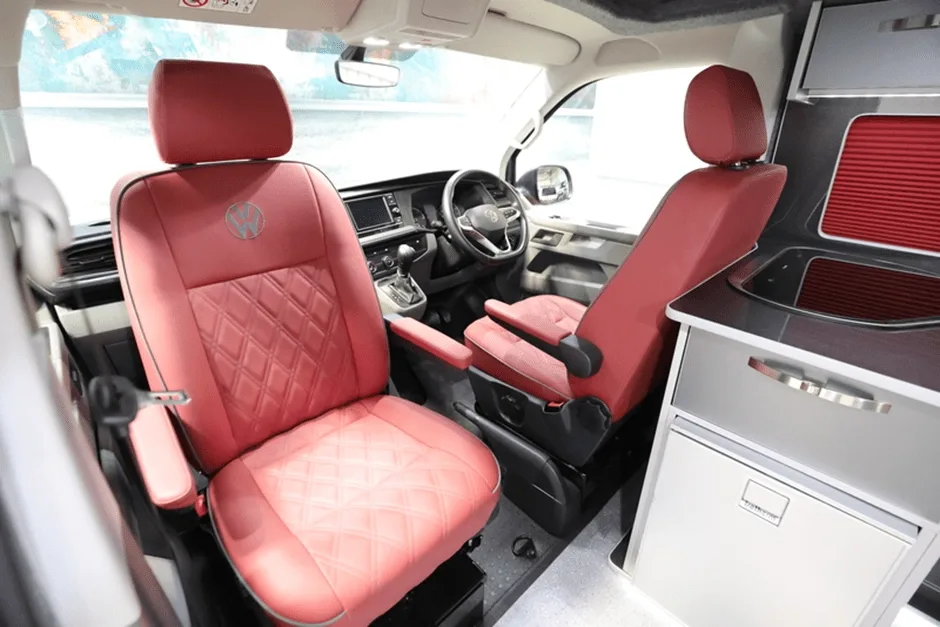 Two front seats in campervan one facing forward