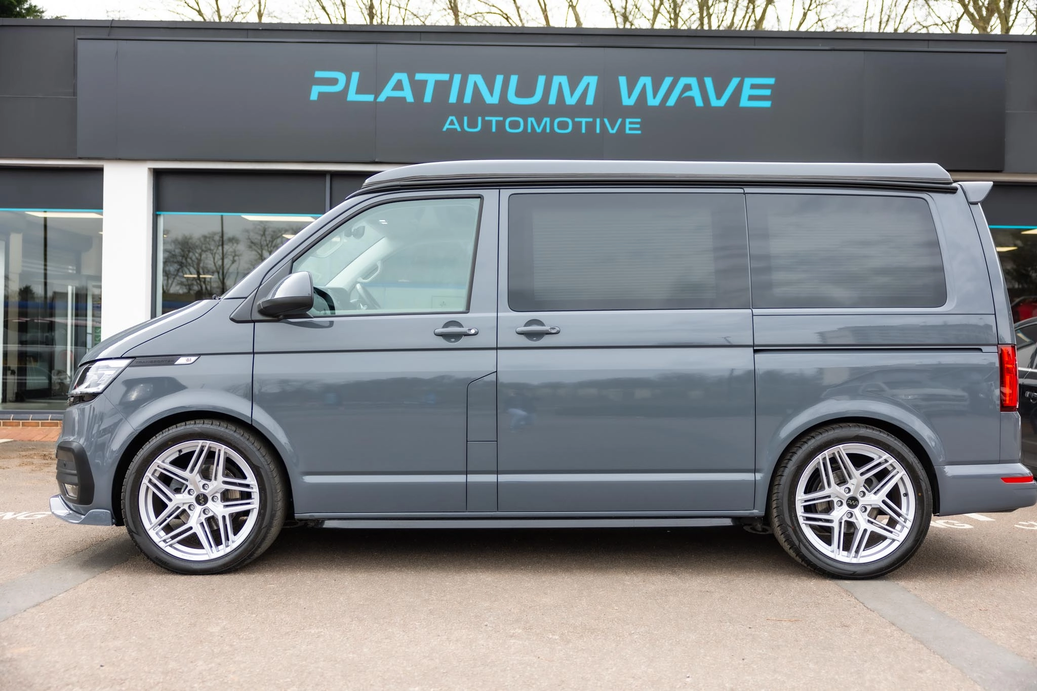 Grey VW transporter campervan parked outside of Platinum Wave Automotive