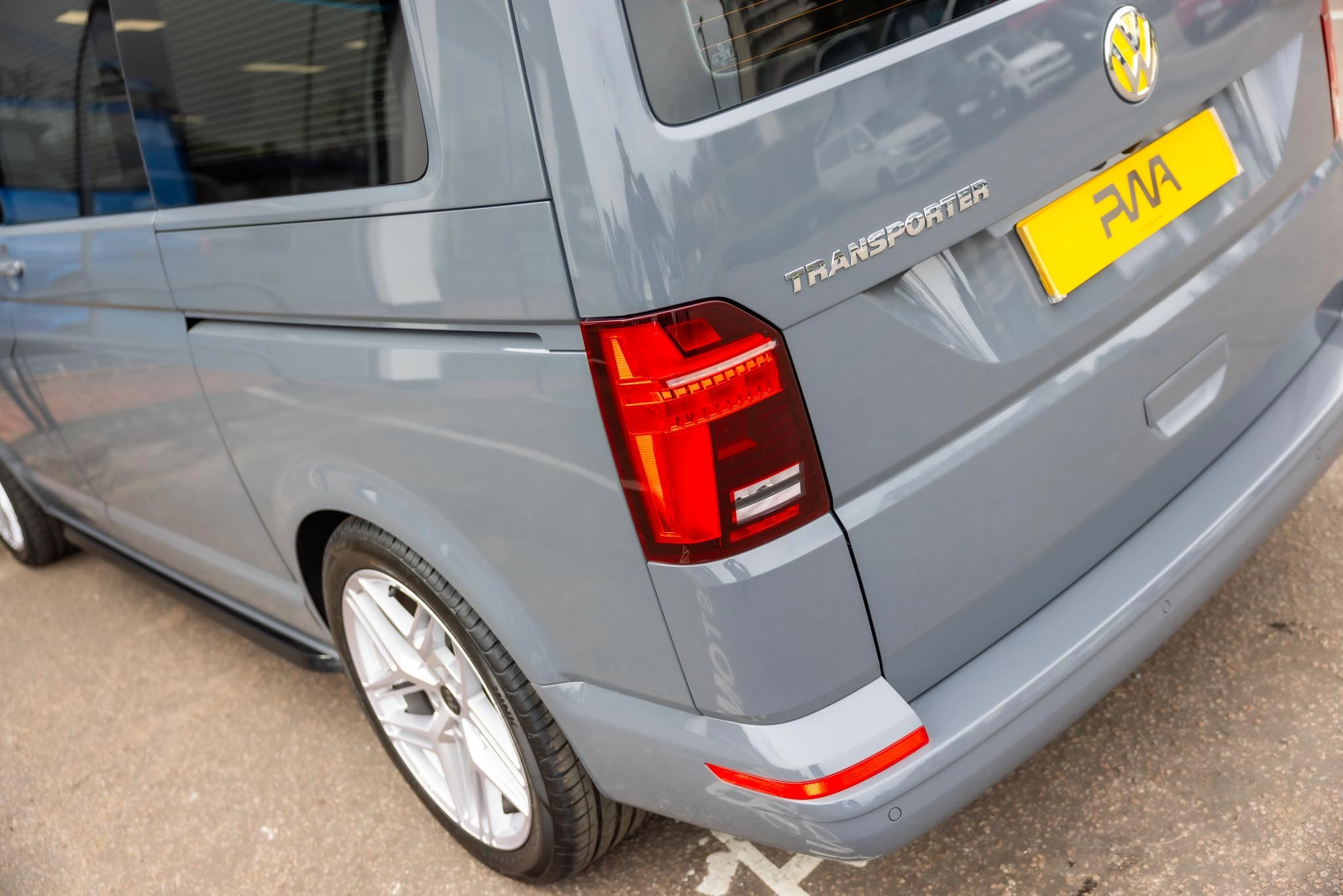 The back of a grey VW Transporter campervan
