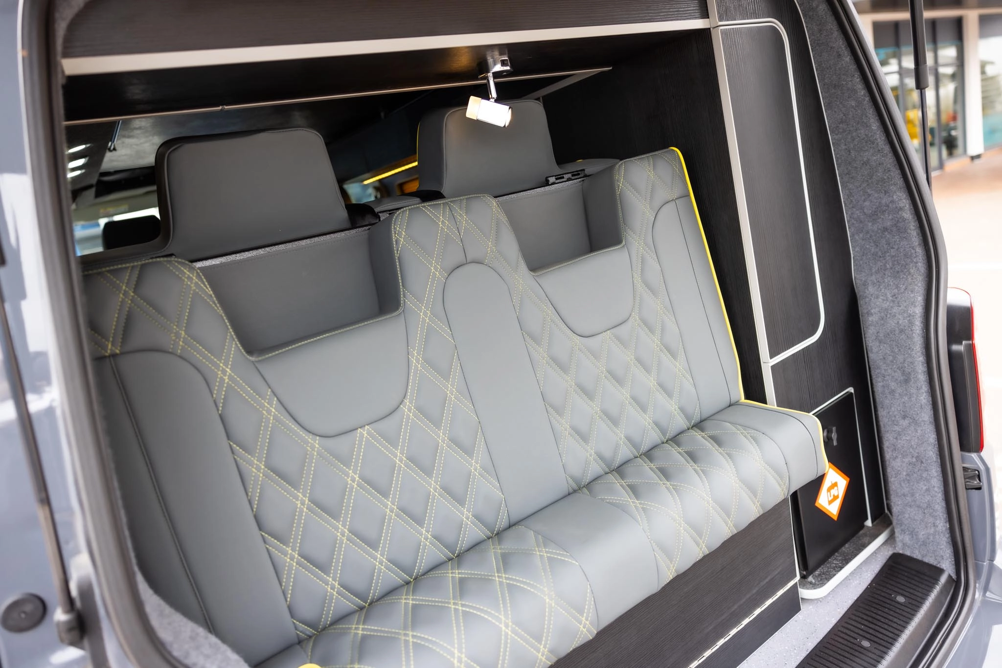 Two campervan seats in the back of a campervan boot
