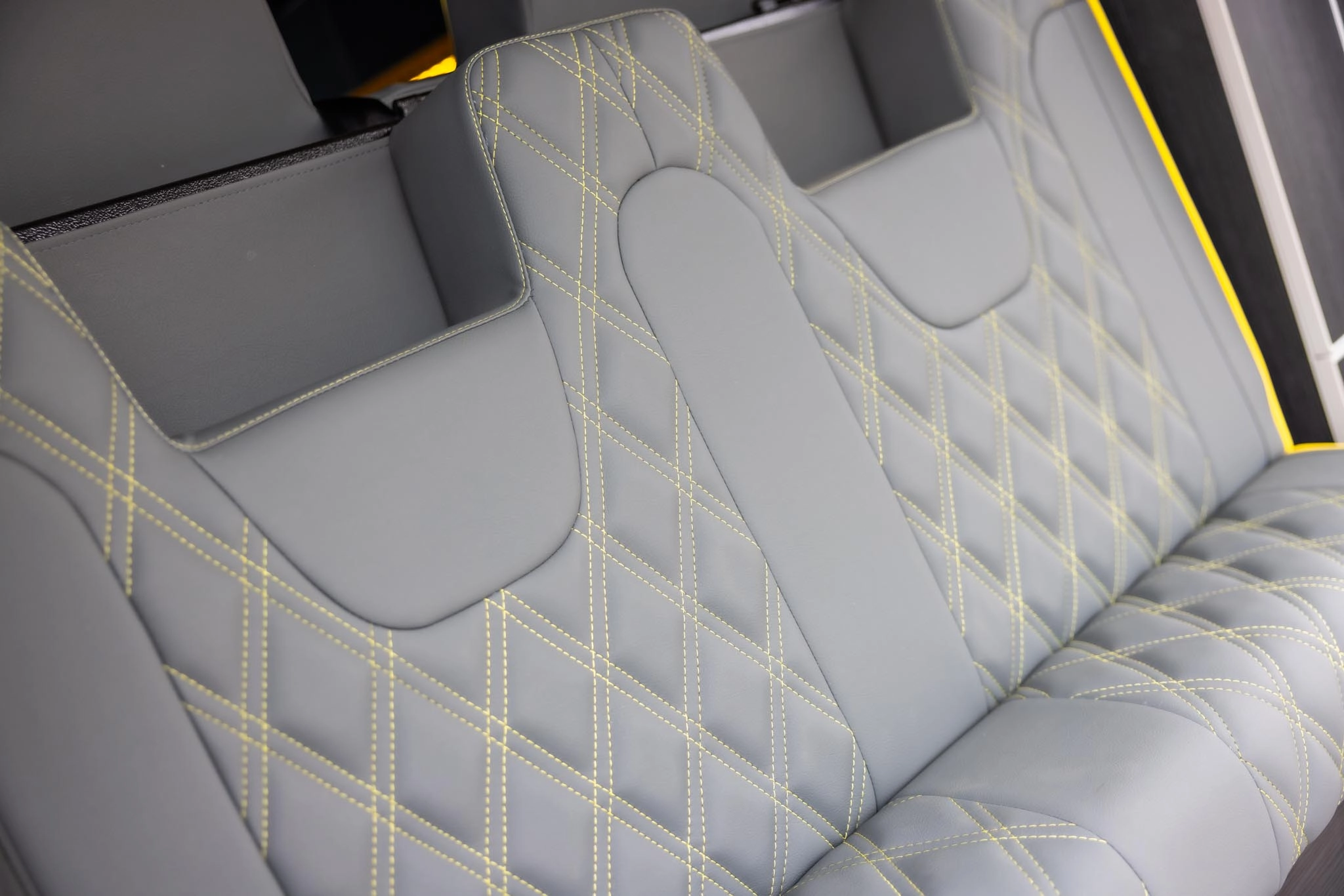 Two campervan seats in grey with yellow stitching
