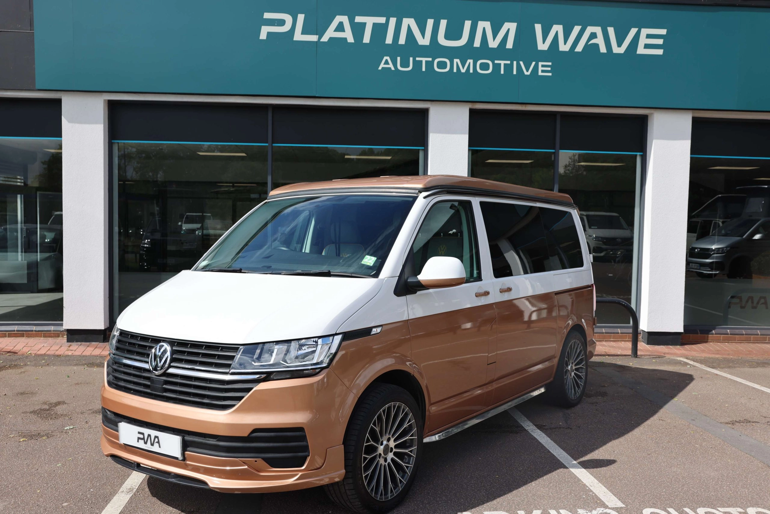 vw two tone whote and copper camper with 5 seats 4 berth
