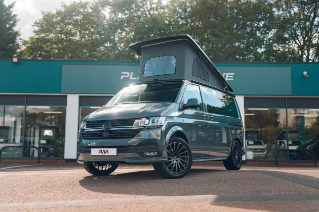 Volkswagen campervan outside Platinum Wave Automotive