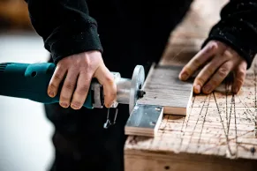 A person making custom cabinets