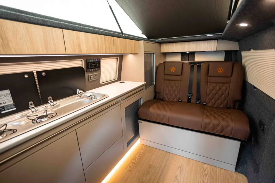Interior of a campervan conversion with seats, cooker and sink