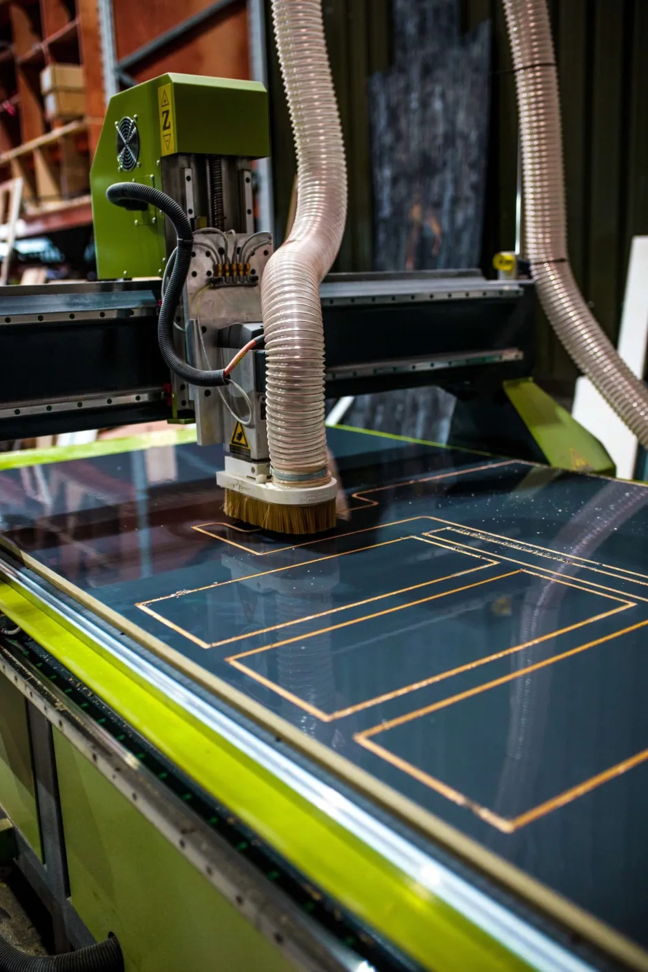 Machine cutting out panels for campervan interiors