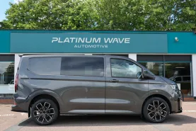 Grey kombi van outside Platinum Wave Automotive showroom