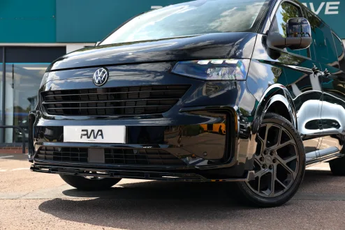 Black kombi van outside Platinum Wave Automotive showroom