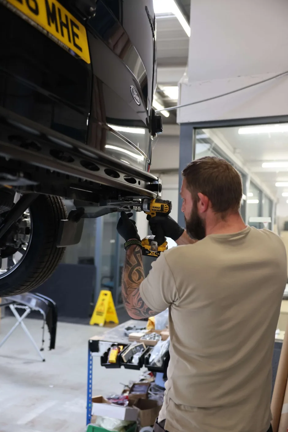 Platinum Wave Automotive employee working on a campervan
